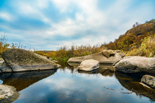 gravel stones in shallow lake water, Sava lake, Belgrade, Serbia