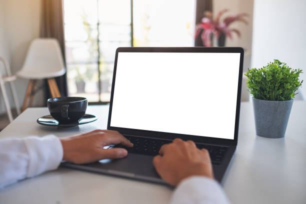 istock a woman using and typing on laptop computer with blank white desktop screen 1297163232