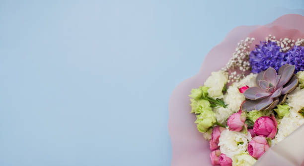 istock Banner with bouquet flowers on blue background 1297165637