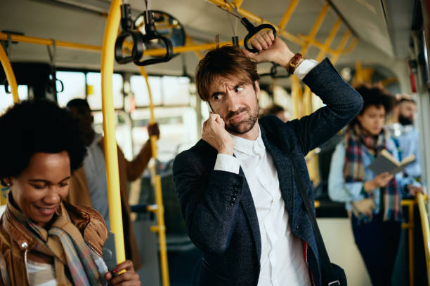 istock Displeased entrepreneur making a phone call while commuting to work by bus. 1297165853
