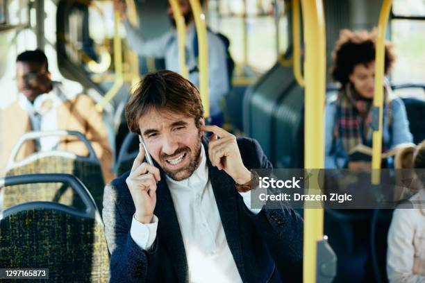 Speak Louder Please Im In A Bus Stock Photo - Download Image Now - Noise, Fingers in Ears, Using Phone