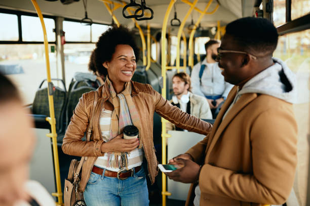 istock Happy African American couple talking while commuting by bus. 1297166171