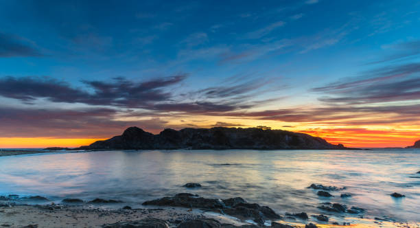istock Colourful High Cloud Sunrise Seascape Panorama and Rock Formations 1297167347