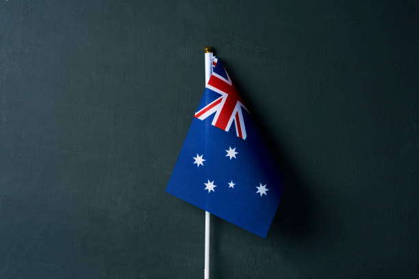 istock australian flag on a dark green background 1297167690