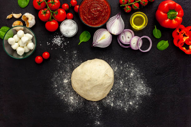 istock Italian pizza preparation and ingredients 1297169531