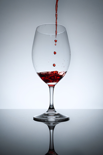 Wine being poured into a wine glass