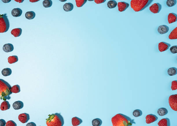 istock Mix of berries background with a copy space 1297173664
