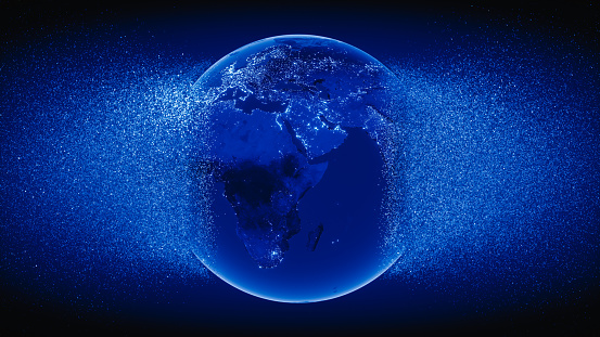 Abstract blue Globe exploding with particles.\n(World Map Courtesy of NASA: https://visibleearth.nasa.gov/view.php?id=55167)