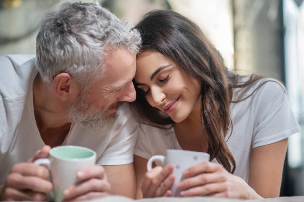 Lovely couple having their mornng coffee together stock photo