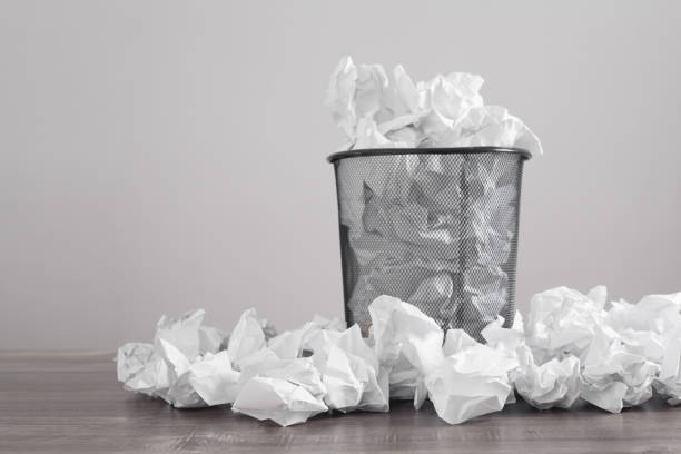 istock Crumpled papers in the trash can. 1297176446