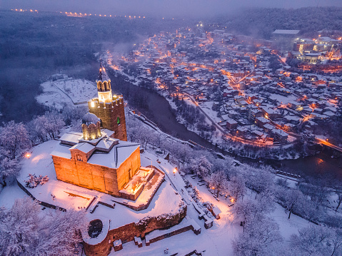 Drone point of view of the town of Veliko Turnovo covered with snow. Winter landscapes.