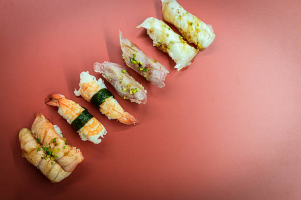 istock Nigiri sushi set with different fish on the red background 1297177374