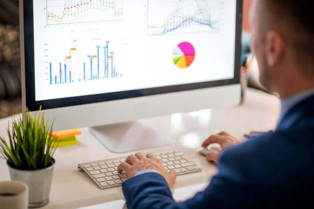 istock Businessman working in office, close up 1297178553