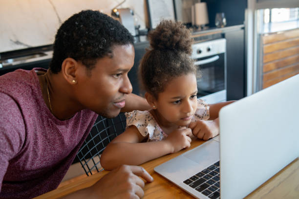 istock A father helping his daughter with homeschool. 1297179630
