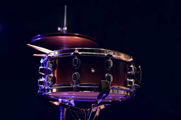 istock Snare drum and drumsticks close up in dark. 1297180322