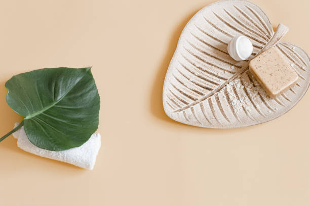 istock Spa composition with bath accessories and flowers top view. 1297181070