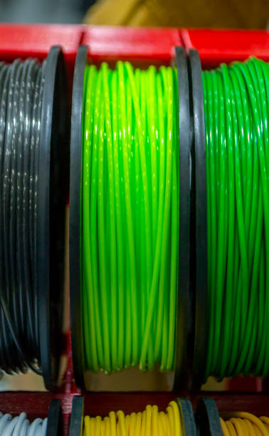 istock Multicolored filaments of plastic for printing on 3D printer close-up 1297185157