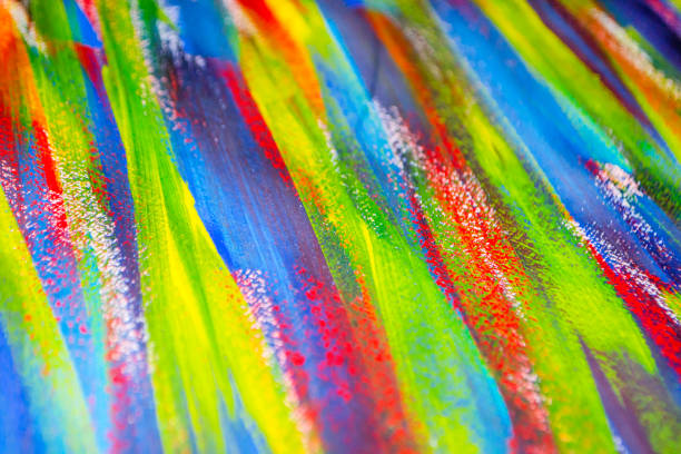 istock Background from different strokes of red, yellow, green and blue paint 1297185192