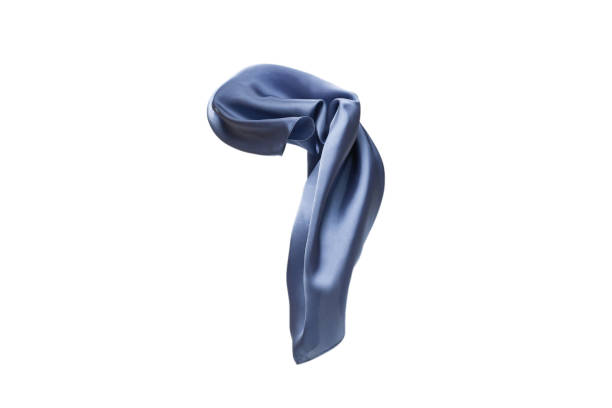 istock Flowing blue silk scarf isolated on white background. 1297186199