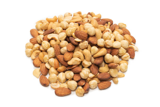 istock Mix of nuts isolated on white background. Top view. 1297186254