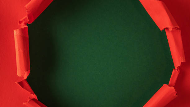 istock Red paper is torn over green background for message. Template for your text. 1297186656