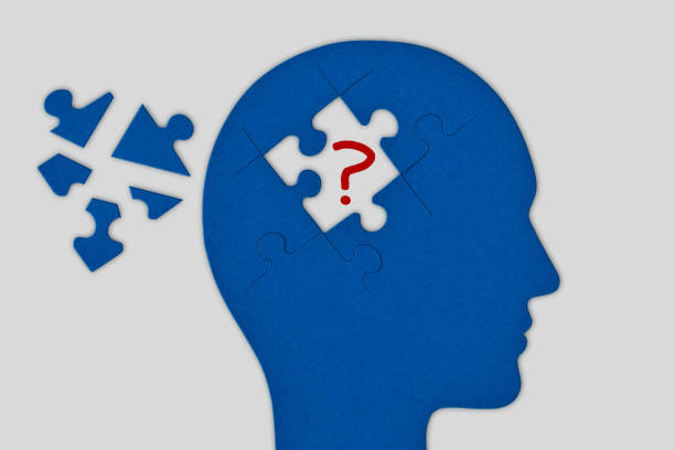 istock Head profile with brain made of broken jigsaw puzzle pieces on white background - Concept of brain diseases, Alzheimer, Dementia 1297187803