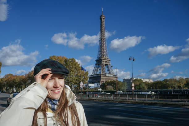 istock Happy young woman in Paris 1297188491