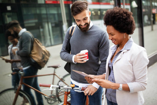 istock Business people on coffee break using digital tablet outdoor 1297188677
