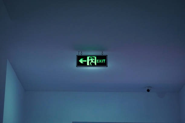 istock an exit sign that lights up in the dark inside a building 1297189463