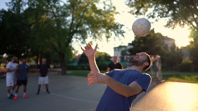 Man Juggling Soccer Ball With Head