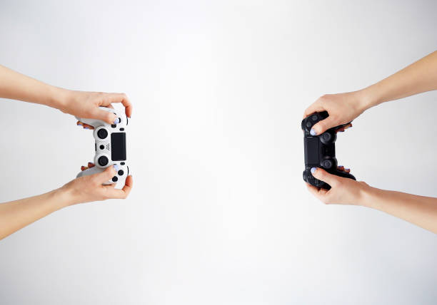 istock Gamepad in hand. Video games. Gamer. Game contest 1297191136