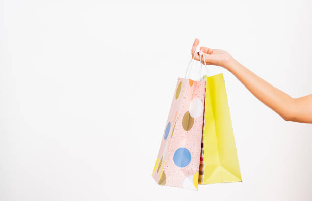 istock women hand holding colorful multicolor shopping bag many packets 1297191466