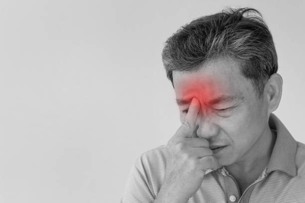 istock sick old senior man headache, dizzyness, sinus inflammation, migraine 1297193479
