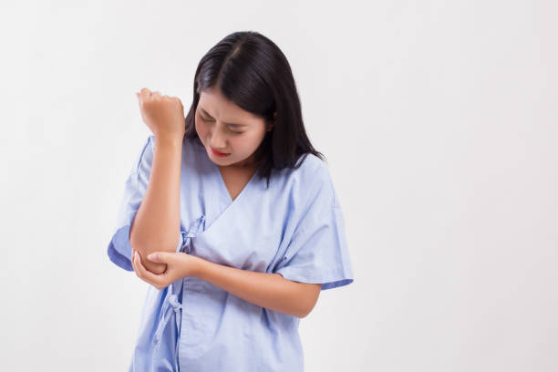 istock woman suffering from elbow joint pain, arthritis, gout 1297193567