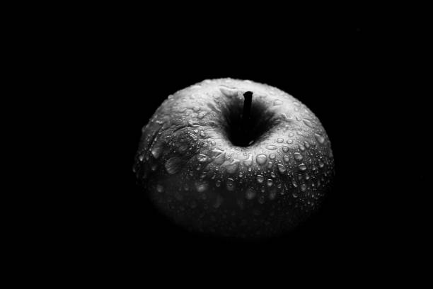 istock An apple in the dark. 1297195791