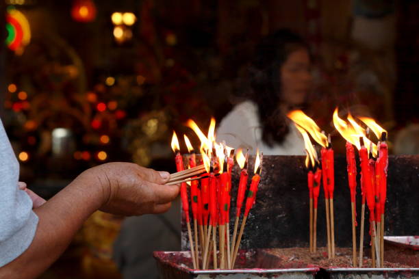 istock group of burning red chinese candle in temple 1297196054