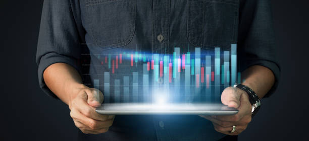 istock Graph growth and increase of chart positive indicators in his business,tablet in hand 1297196065