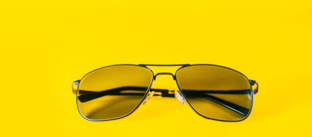 istock Summer sunglasses with high protection against solar rays, isolated on a yellow background. Eye and vision protection in summer. 1297198465