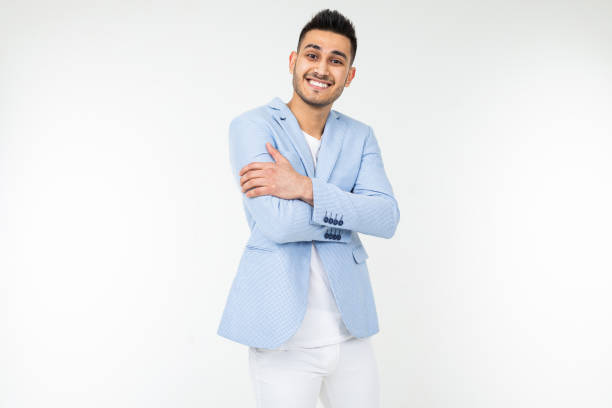 istock young man in a blue jacket stands on a white background with copy space 1297198668