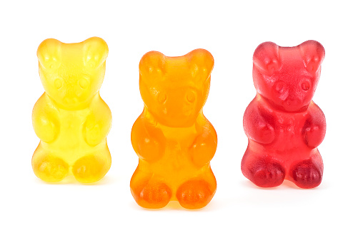 Three Ñolorful jelly gummy bears isolated on a white background. Sweet jelly marmalade teddy bears.