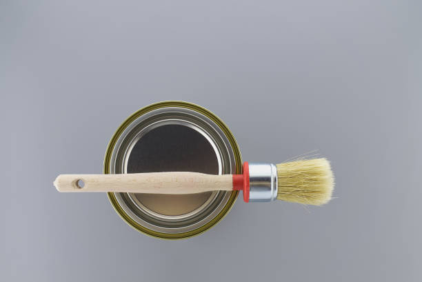 istock Clean bristle brush tin of paint over a grey 1297199468