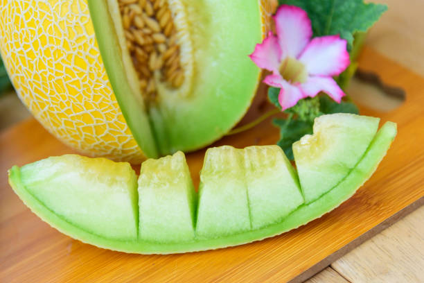 istock Fresh green melon on wood plate 1297199528