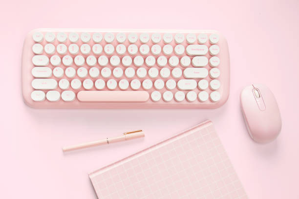 istock flat lay pink color computer and stationery 1297199902