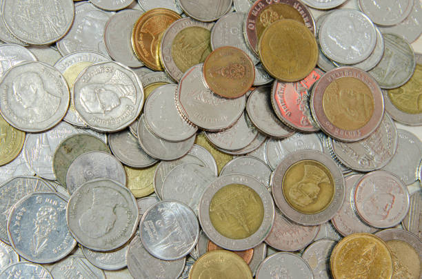 istock Money coins put together background. Thai money 1297200705