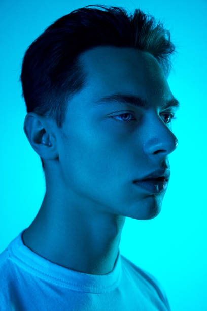 istock Handsome caucasian man's portrait isolated on blue studio background in neon light, monochrome 1297201832