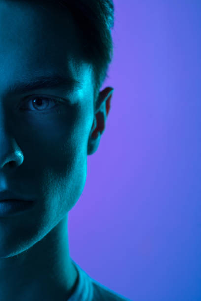 istock Handsome caucasian man's portrait isolated on purple studio background in neon light, monochrome 1297201971