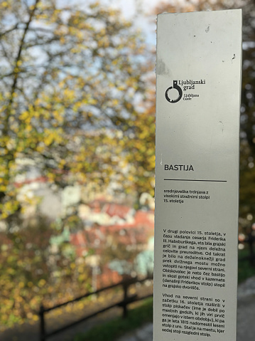Ljubljana, Slovenia - November 8, 2018:  Ljubljana Castle description sign in Slovenian.