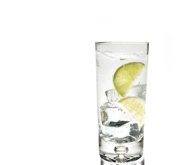 istock Glass of gin and tonic with ice and lime 1297202816