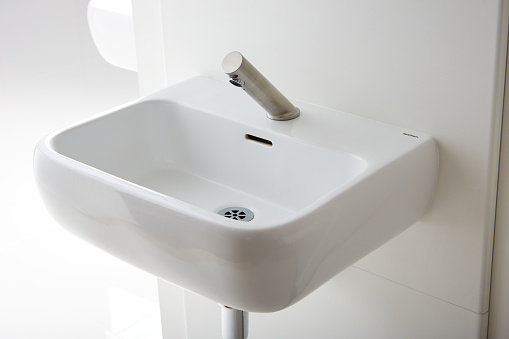 Shot of a bathroom sink with automatic touchless sensor faucet