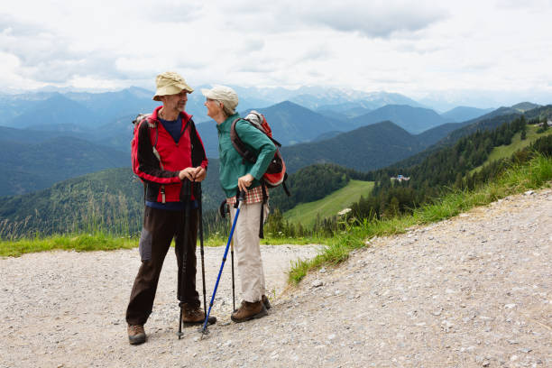 istock Senior couple hiking in the mountains 1297203576